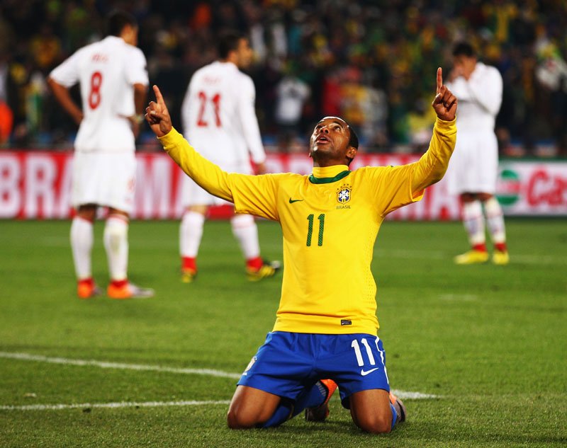 Robinho celebrates scoring Brazil's third goal against Chile.